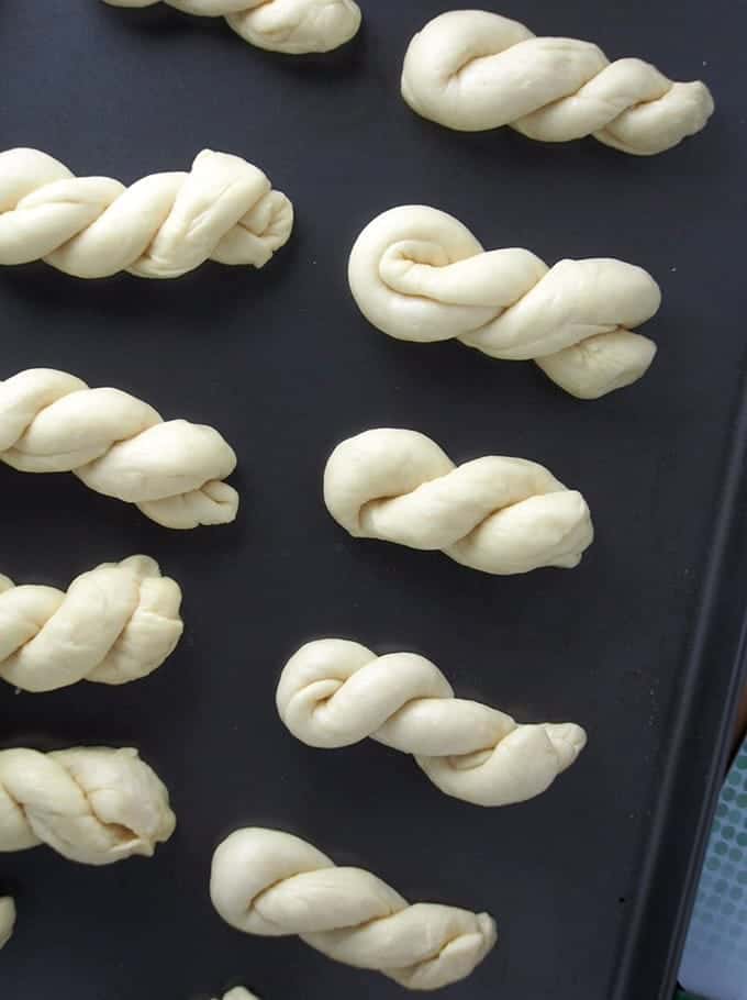 twisted yeast dough on a baking sheet