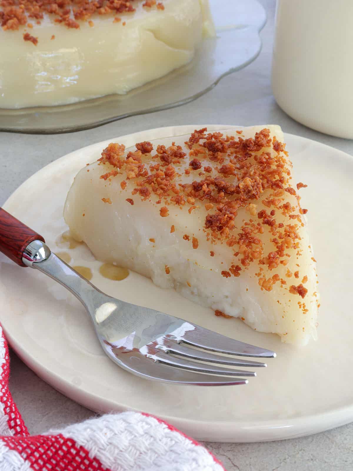 slice of kalamay lansong on a white plate with a fork