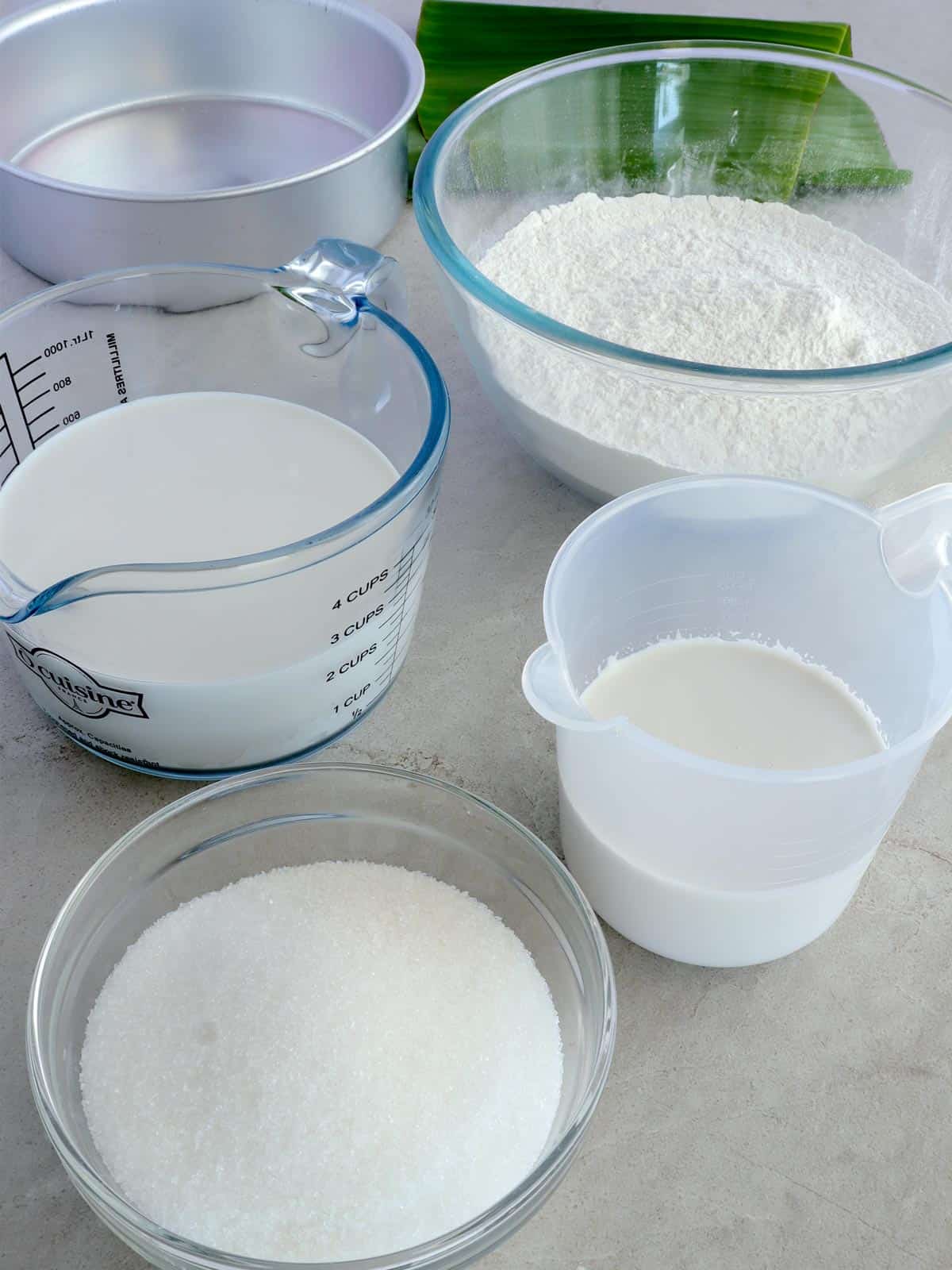 glutinous rice flour, sugar, coconut milk, coconut cream in bowls