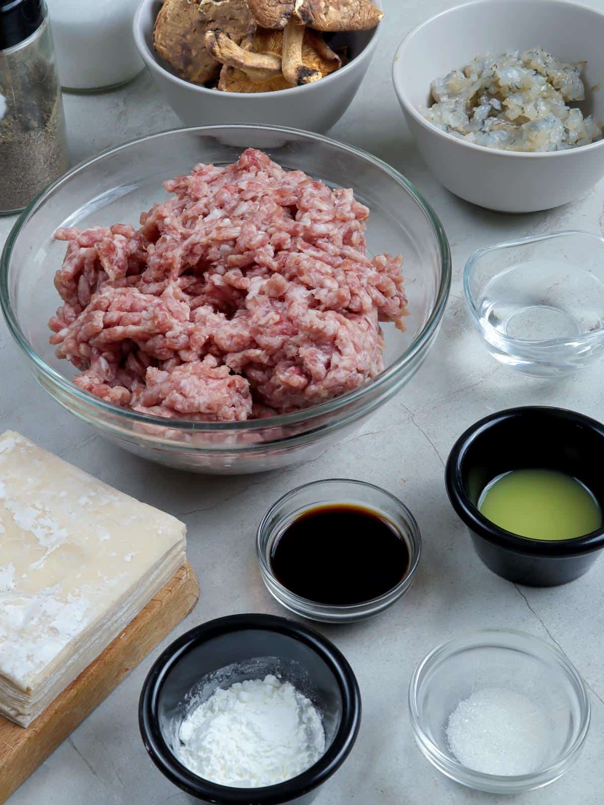 ground pork, cornstarch, soy sauce, shitake mushrooms, minced shrimp, ginger juice, shumai wrappers