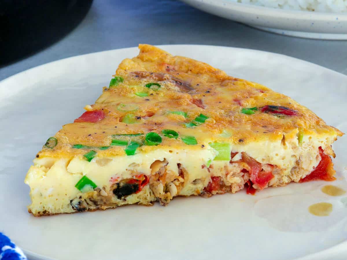 slice of mussel omelet on a white plate