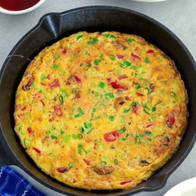 tortang tahong in a cast iron pan