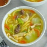 Pancit Lomi in white bowls.