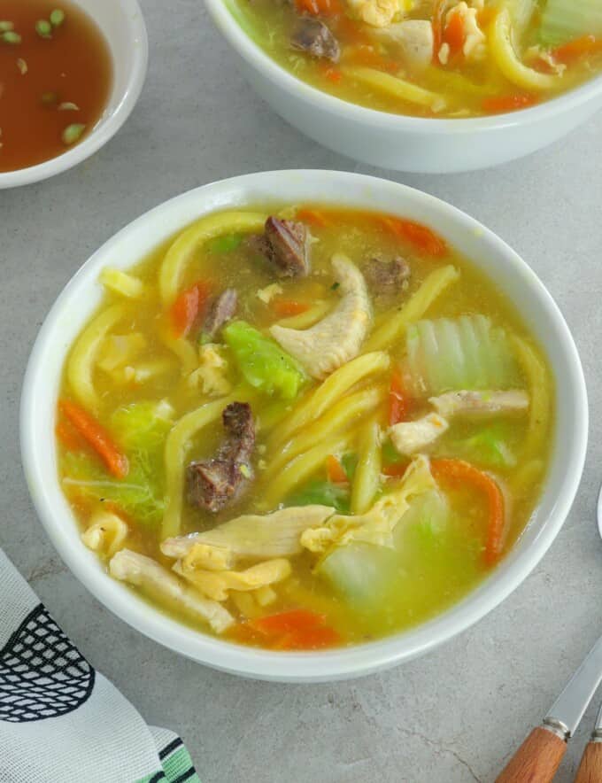 Pancit Lomi in white bowls.