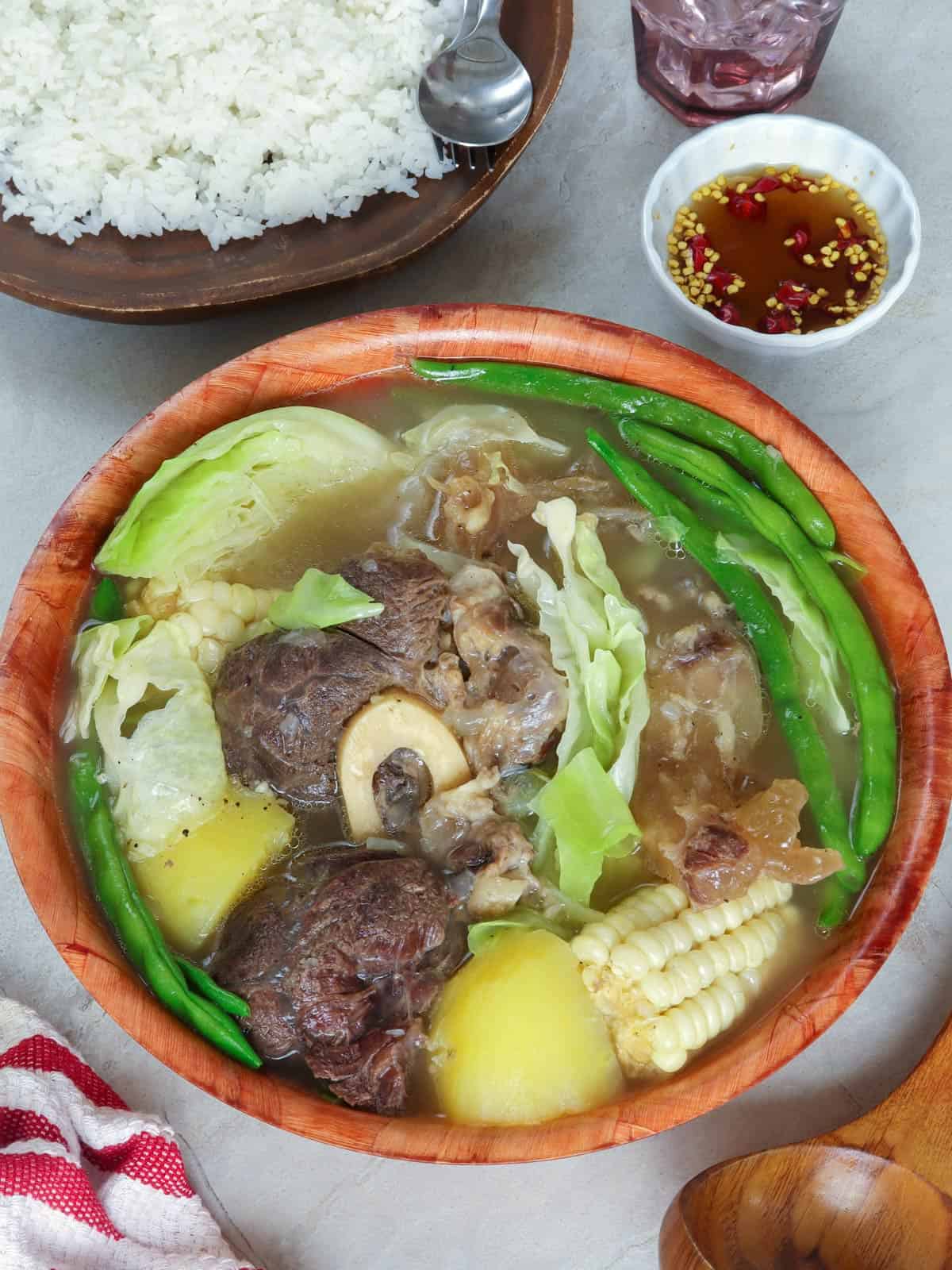 beef nilaga in a wooden serving bowl