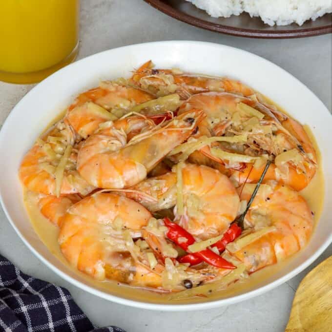 shrimp in creamy coconut milk in white serving bowl