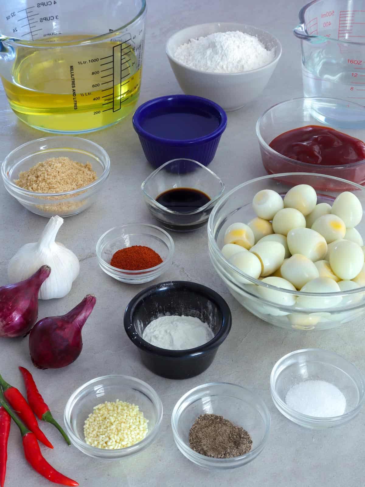 boiled quail eggs, chili peppers, flour, water, oil, onion, garlic, salt, pepper, sugar in bowls