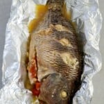 pinaputok na tilapia baked in aluminum foil.