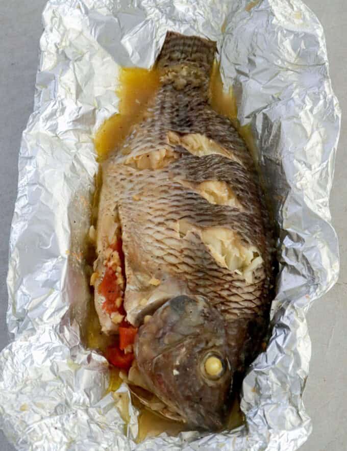 pinaputok na tilapia baked in aluminum foil.