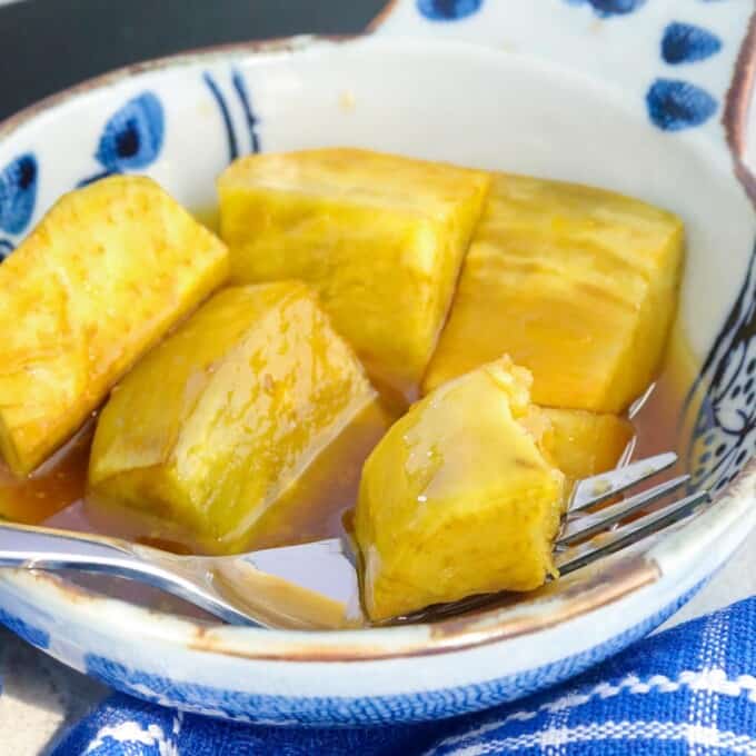 bowl of sweetened kamote with a fork