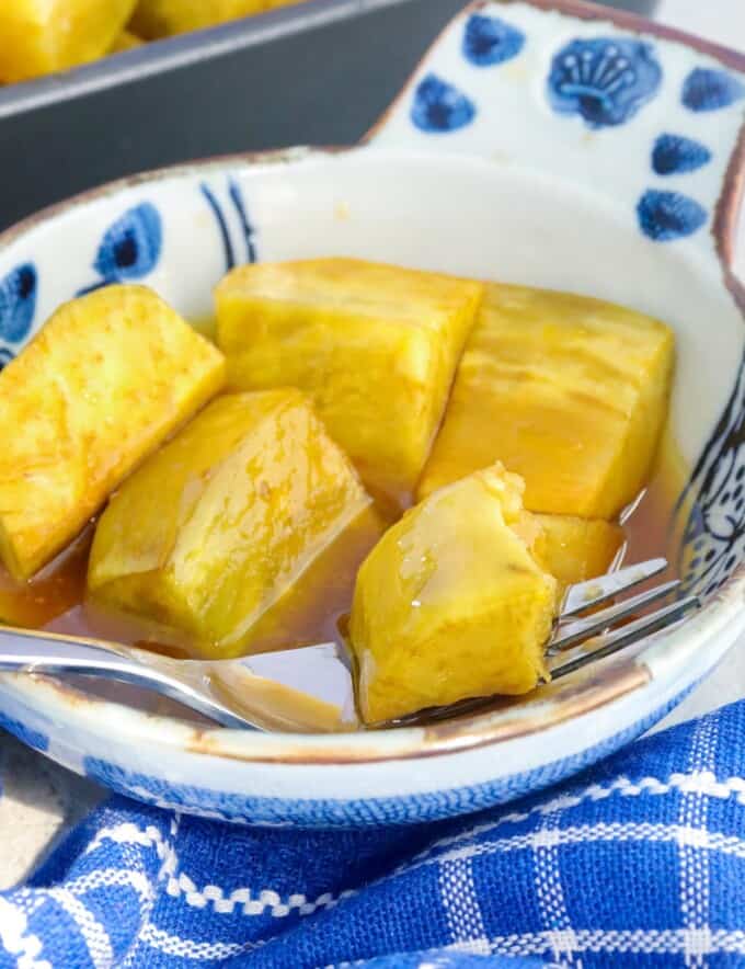 bowl of sweetened kamote with a fork