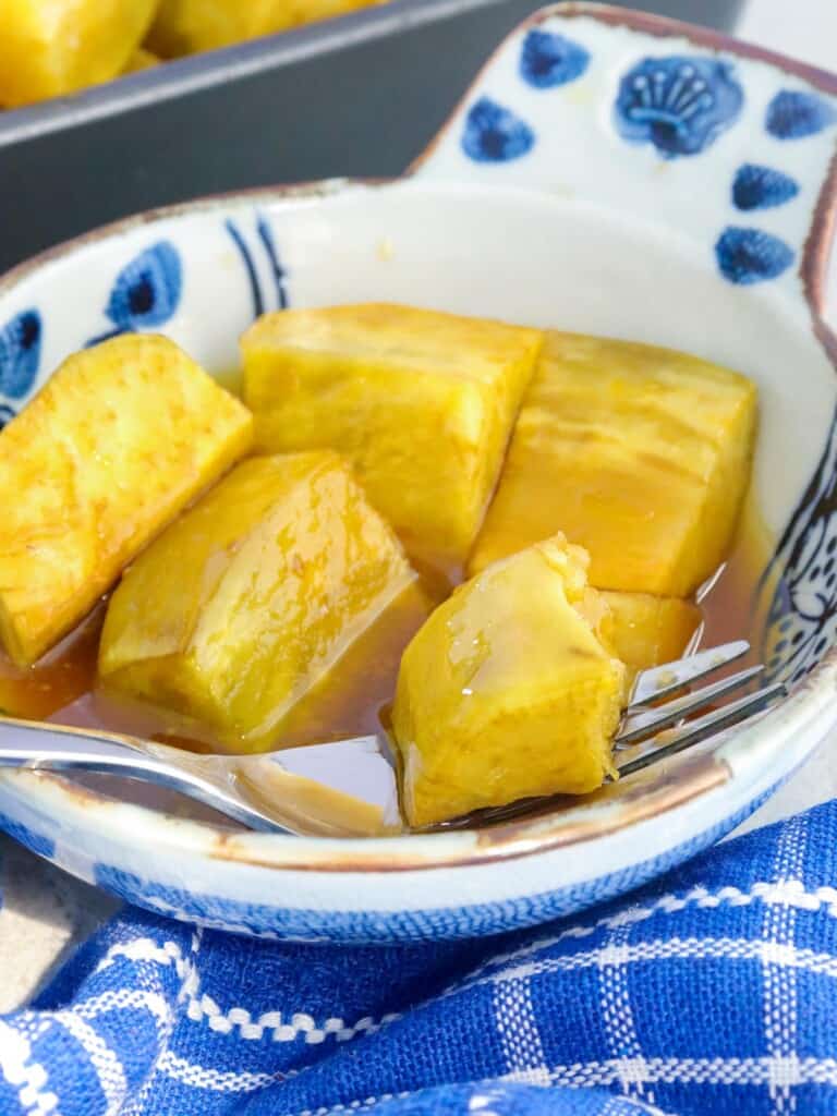 bowl of sweetened kamote with a fork