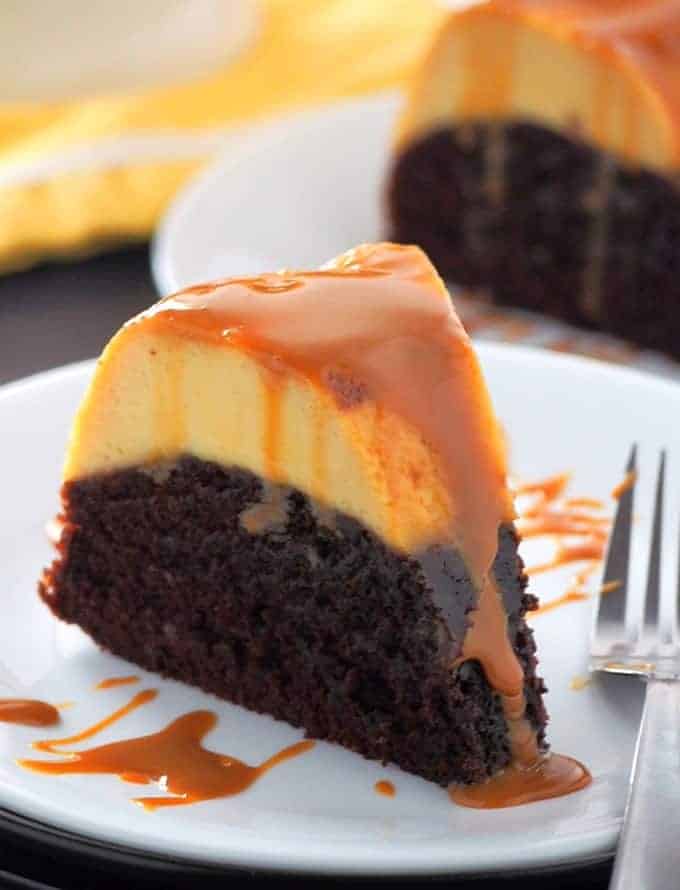 slice of chocolate flan cake in a white serving plate