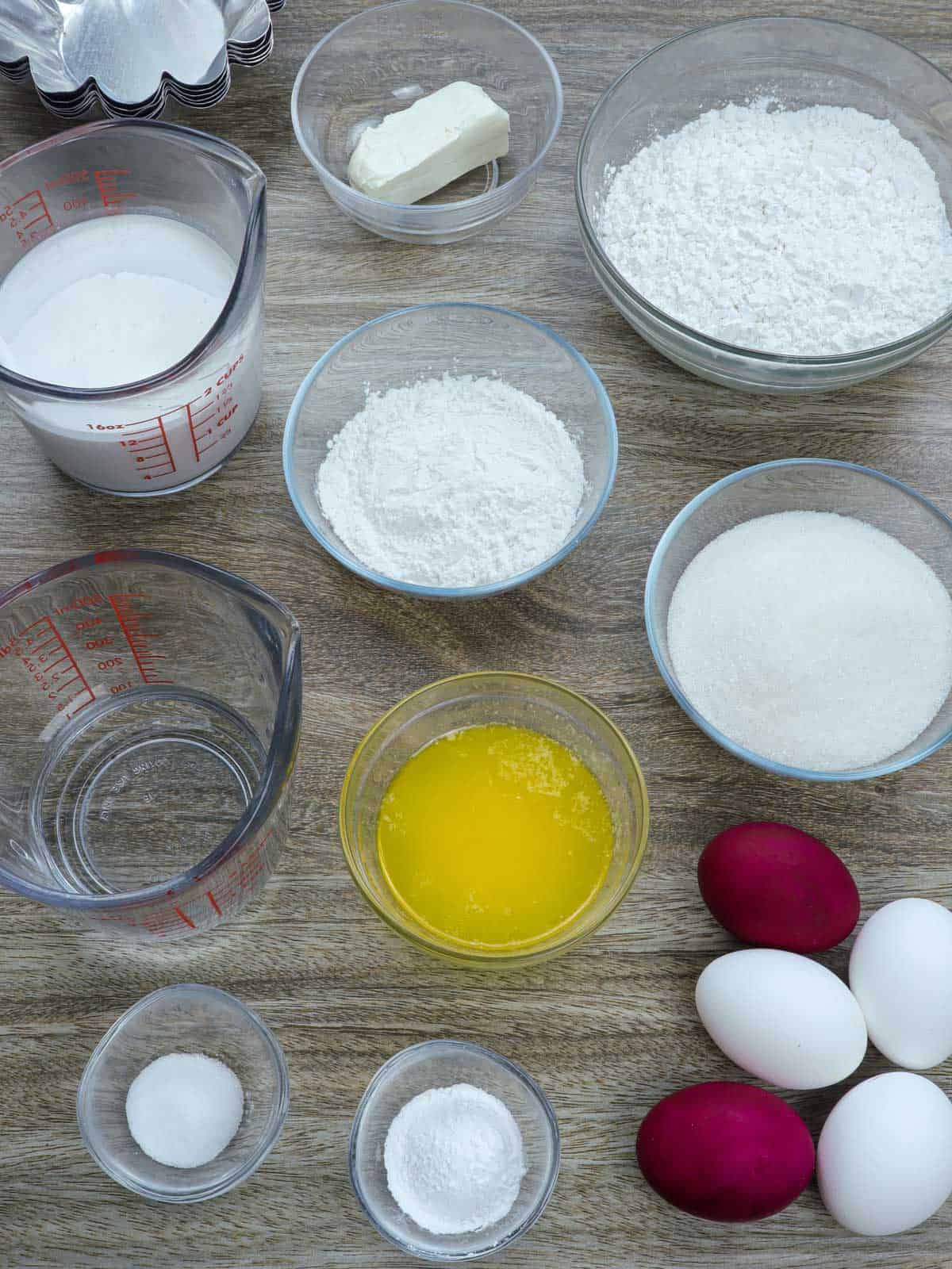 rice flour, glutinous rice flour, melted butter, sugar, coconut milk, water, grated coconut, baking powder, salt, eggs, salted eggs