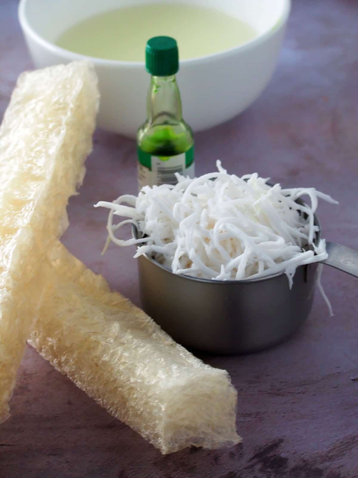 white agar agar bars, shredded coconut, pandan extract and coconut milk