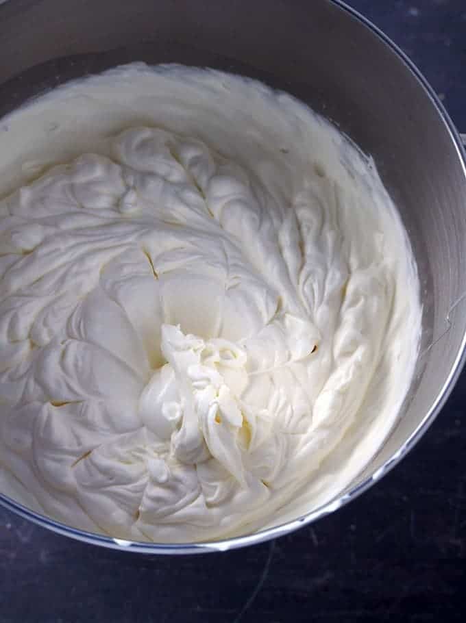 whipped cream in a the bowl of stand mixer