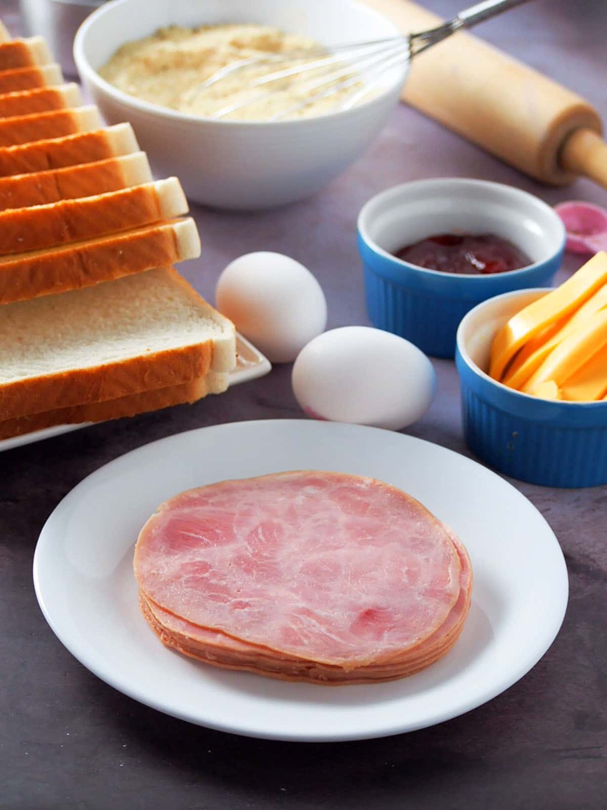 sliced bread, ham, eggs, cheese, bread crumbs