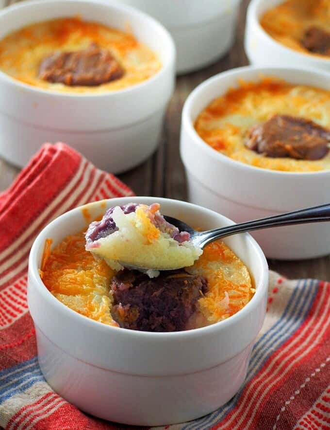 serving cassava ube cake with a spoon