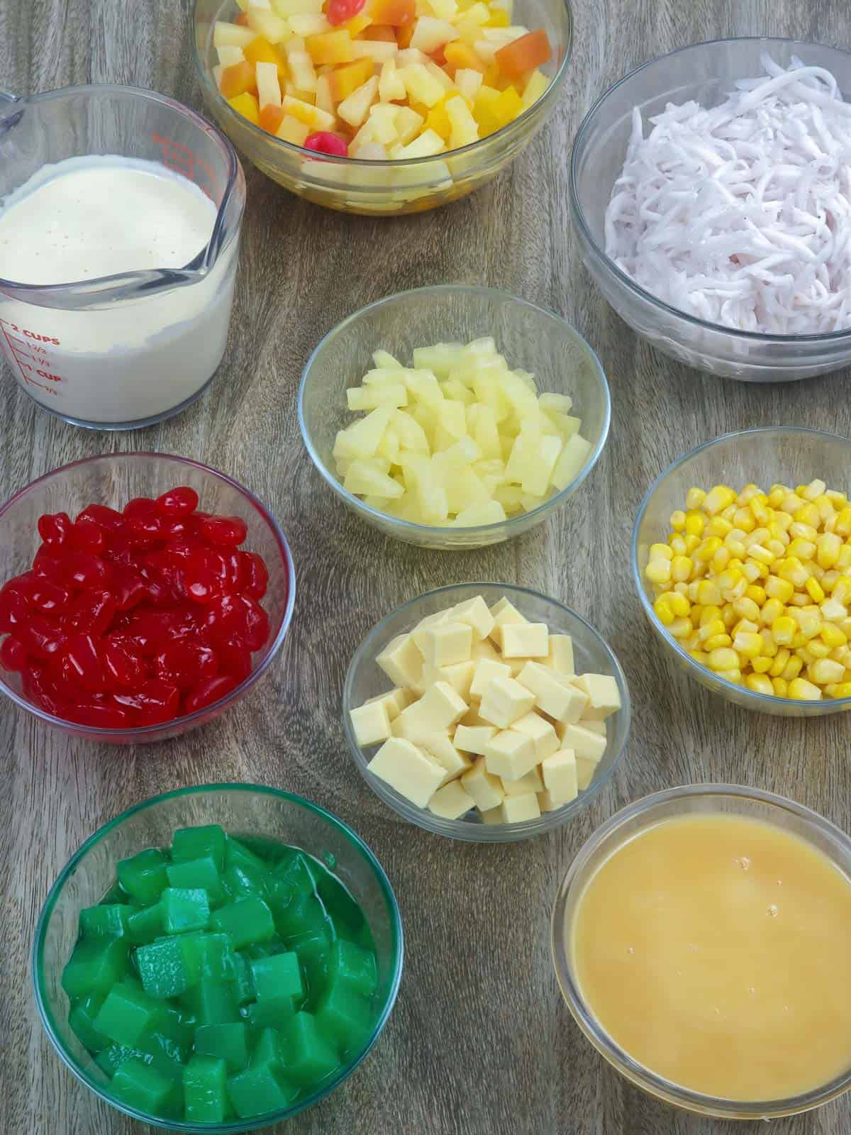 kaong, nata, cheese cubes, corn kernels, young coconut, condensed milk, Nestle cream in bowls