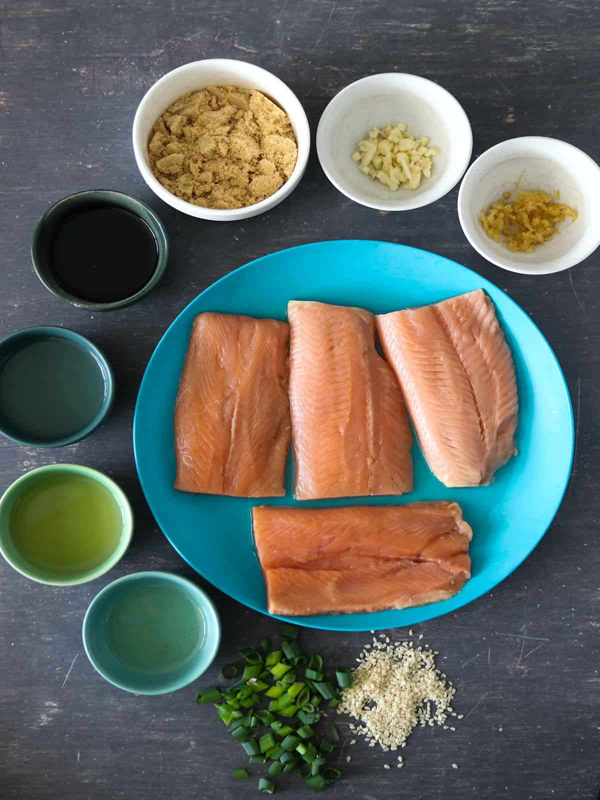 salmon fillets, brown sugar, mirin, soy sauce, sake, garlic, and ginger