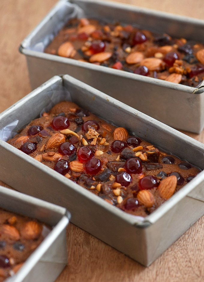 Fruitcake with nuts and glazed fruit baked in aluminum loaf pans