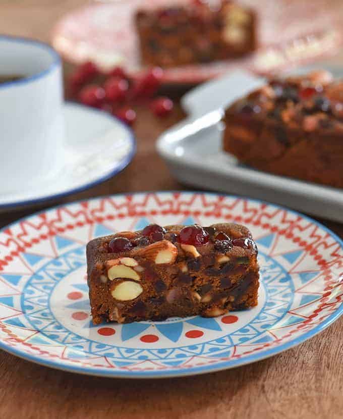 sliced holiday fruitcake on a serving plate