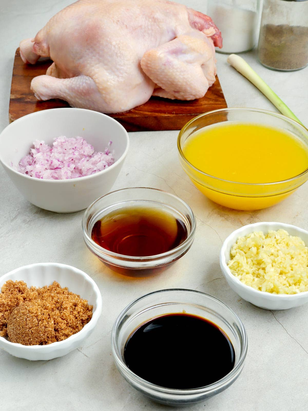 whole chicken, calamansi juice, minced garlic, chopped onions, brown sugar, fish sauce, lemongrass, soy sauce