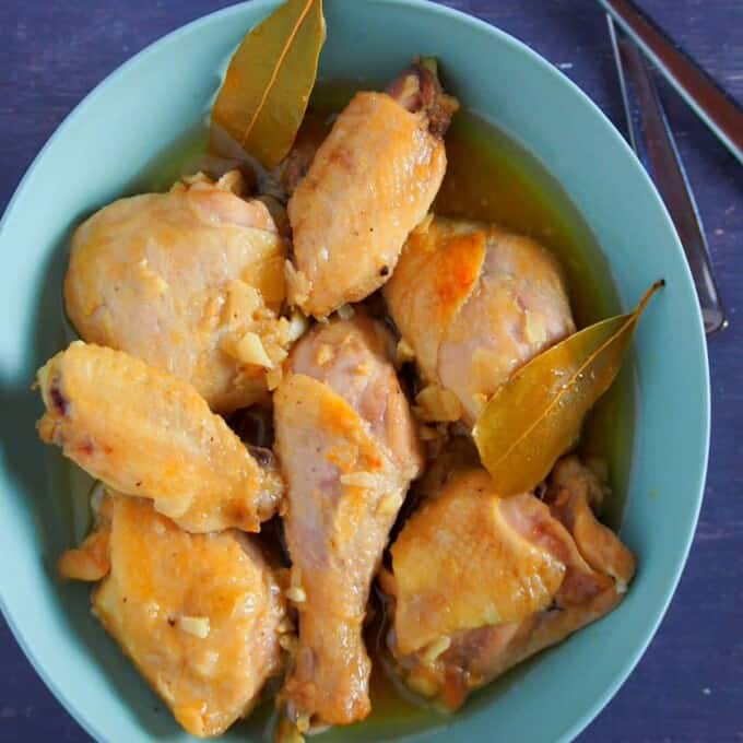 top view of Chicken Adobo with fish sauce on a blue bowl