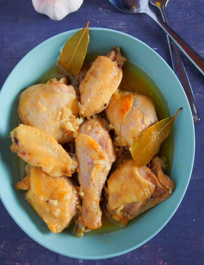 top view of Chicken Adobo with fish sauce on a blue bowl