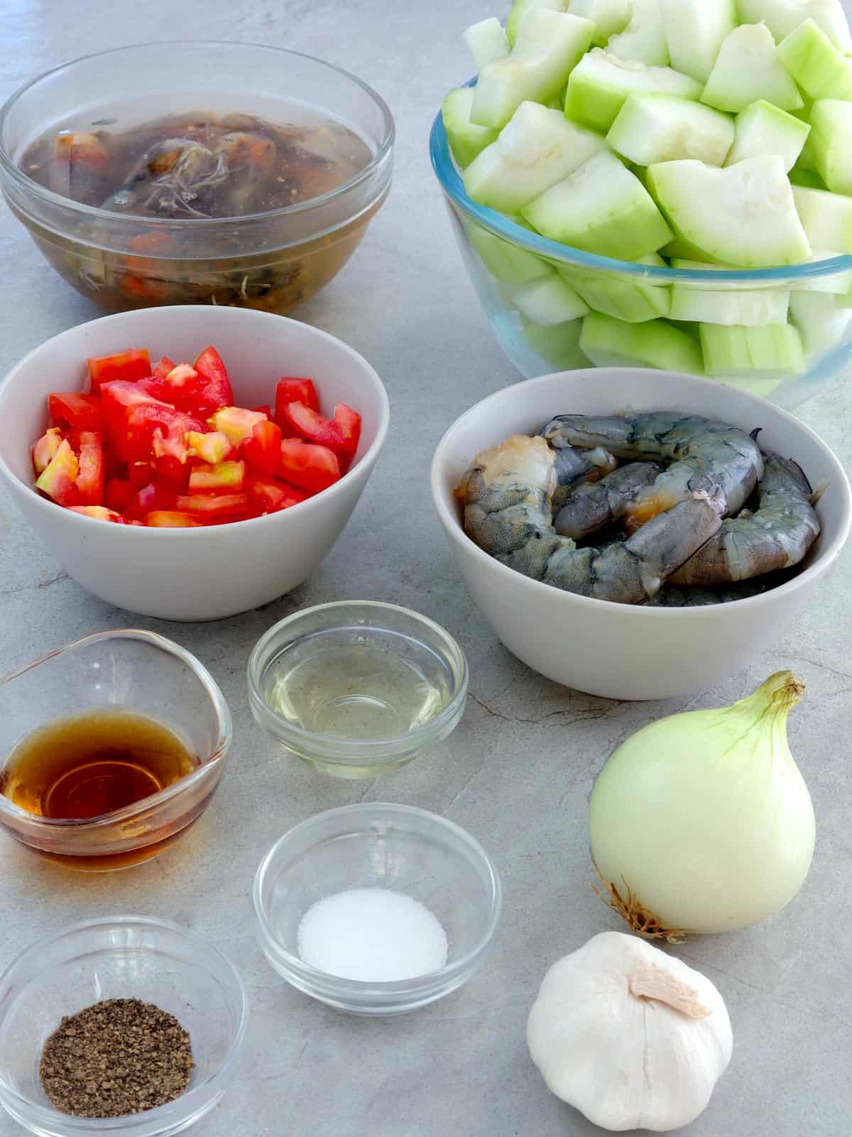 peeled shrimp, tomatoes, garlic, onions, and cubed bottle gourd