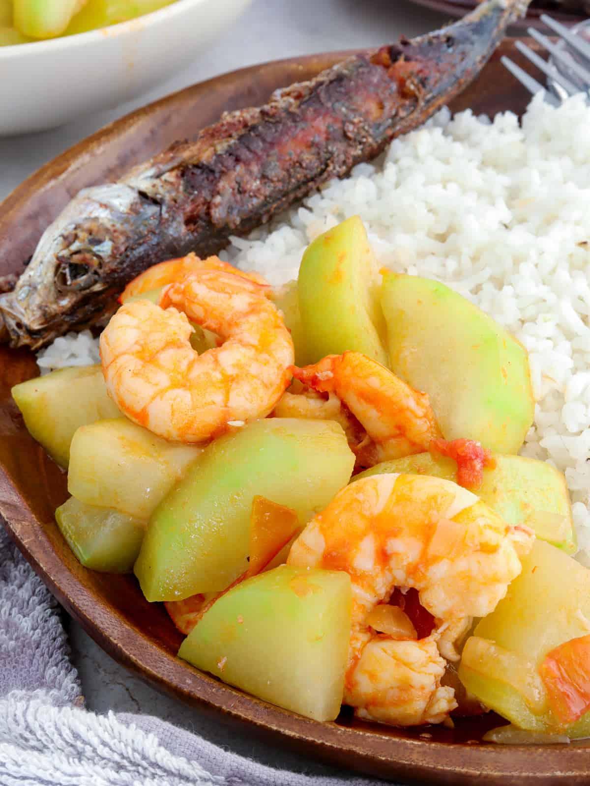 Ginisang Upo at Hipon with steamed rice and fried fish on a serving plate