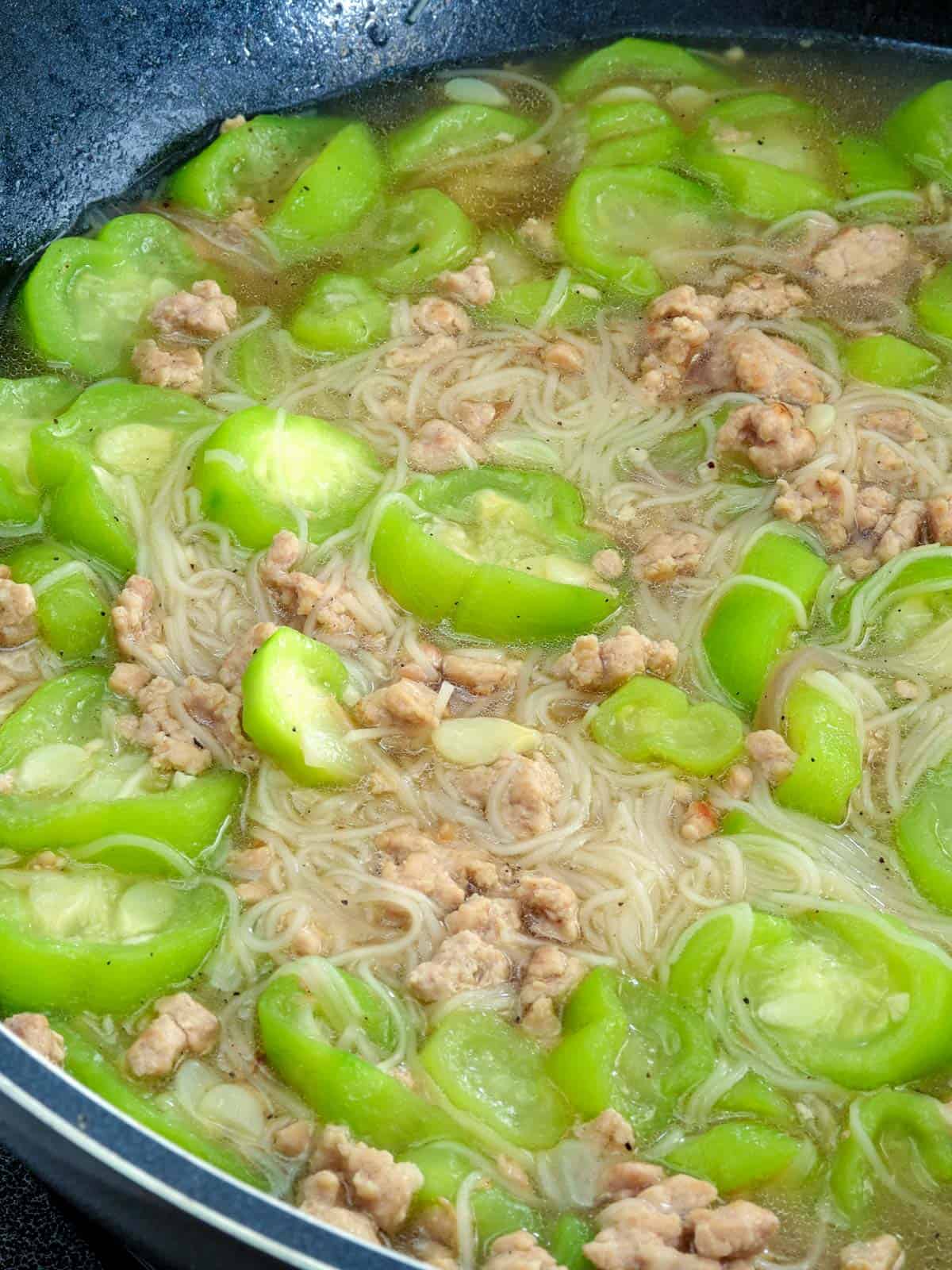 miswa soup with patola and ground pork in a pot