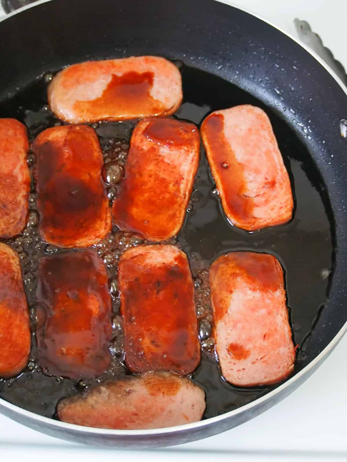 Spam slices pan-grilled in a sweet soy sauce mixture