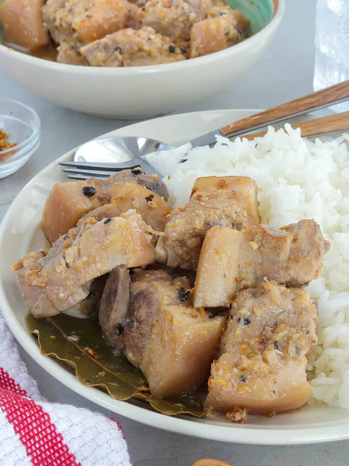 White pork adobo on a plate with steamed rice