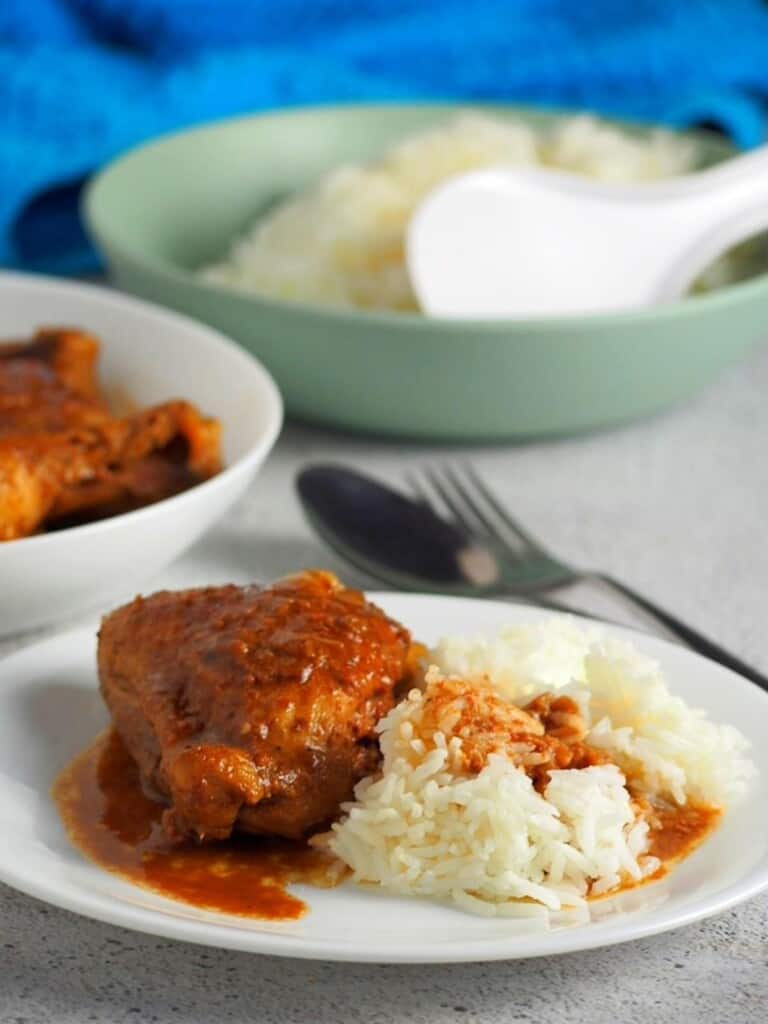 adobong manok with liver spread on a plate with steamed rice