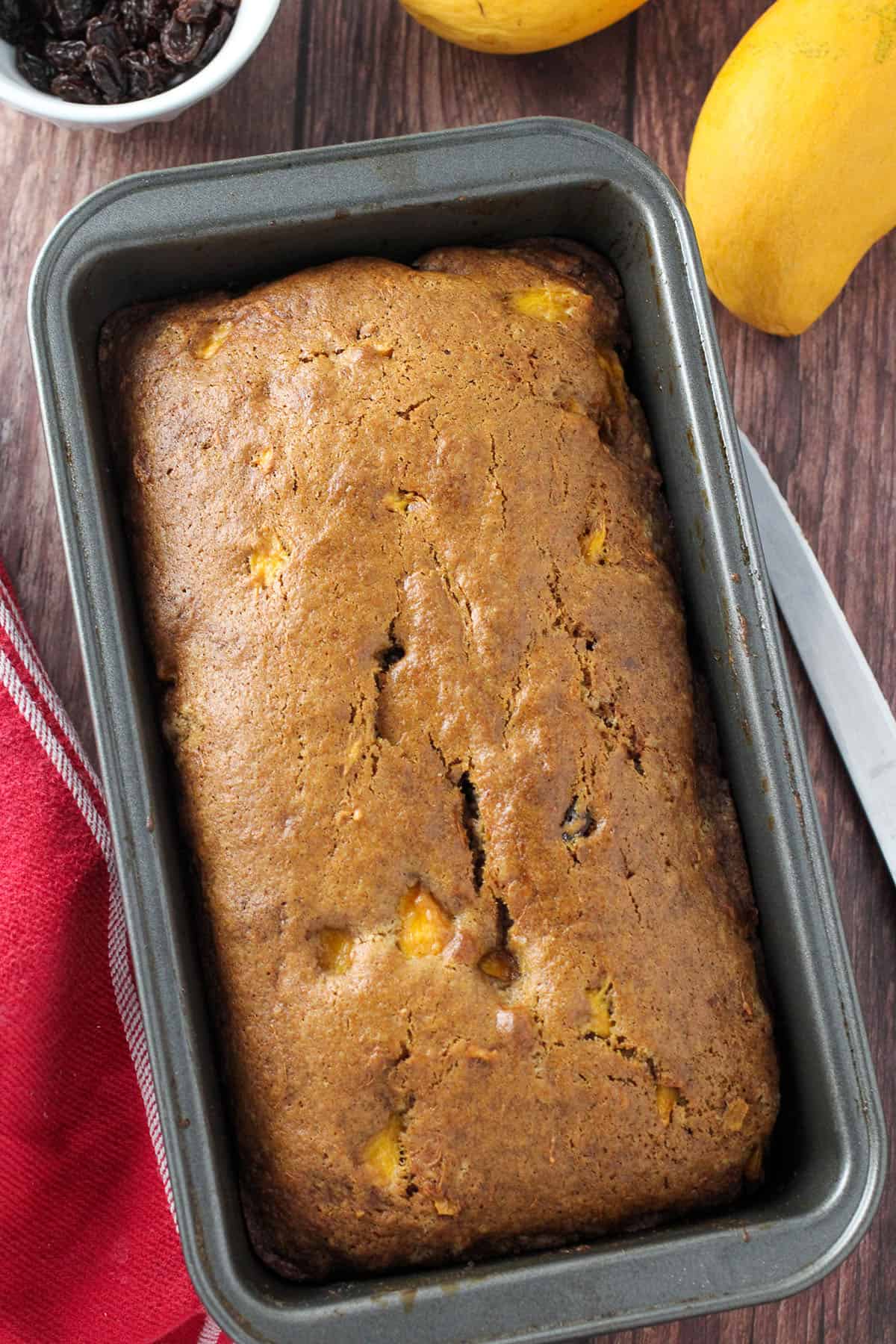 freshly baked Mango Bread on in a loaf pan