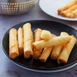 Cheese Sticks on a black plate