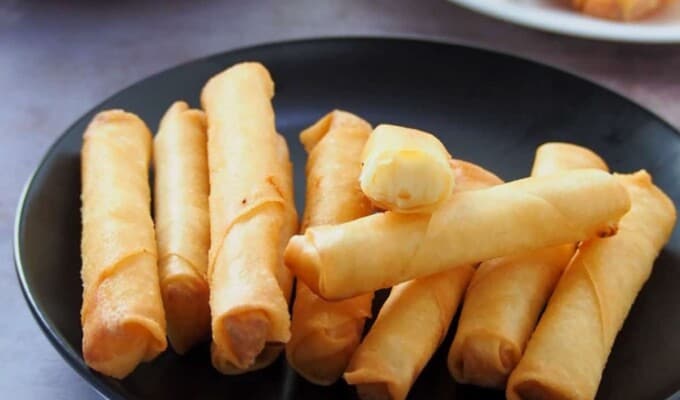 Cheese Sticks on a black plate