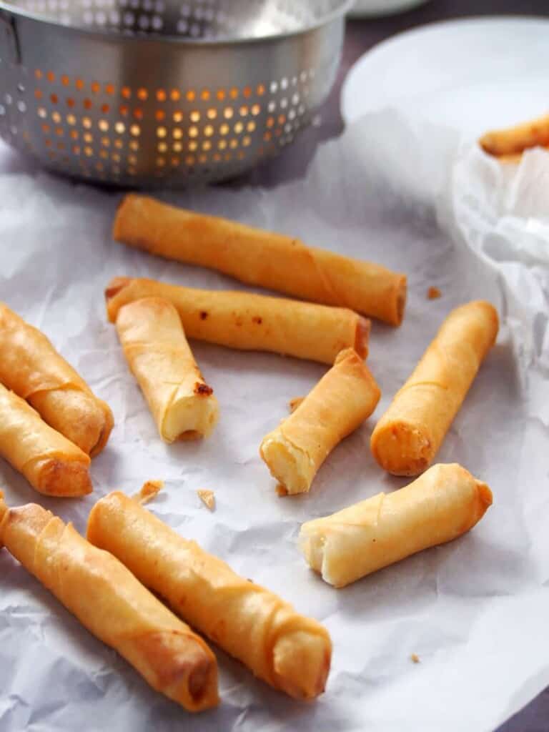 cheesy spring rolls on parchment paper