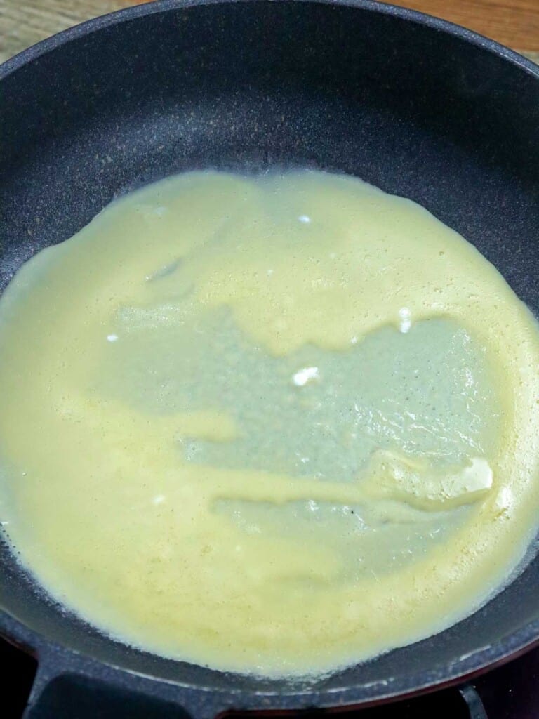 making crepe wrapper on a pan