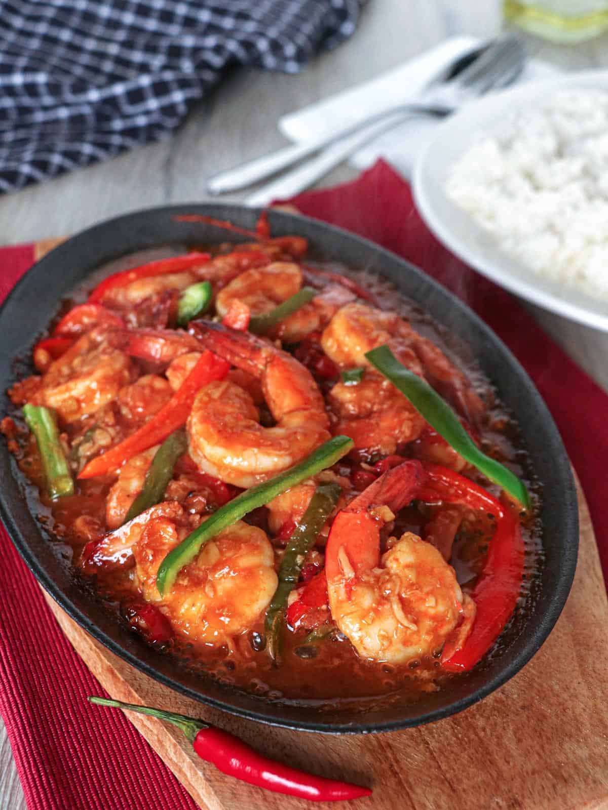 sizzling gambas on a cast iron skillet