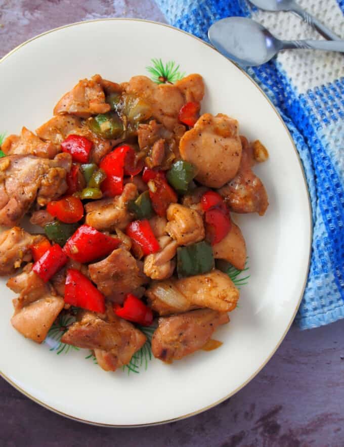 Chinese Black Pepper Chicken Stir-fry with bell peppers on a white serving platter