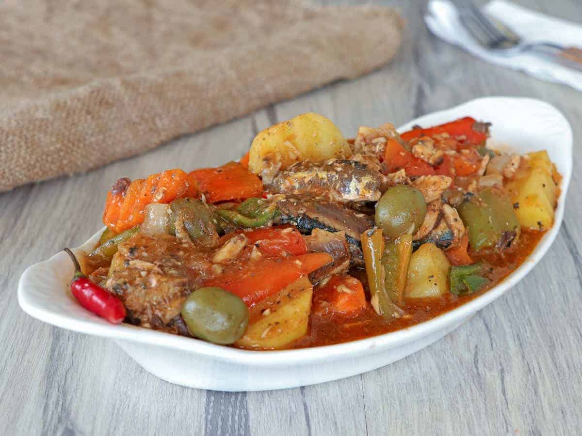 Sardines Caldereta in a white serving dish