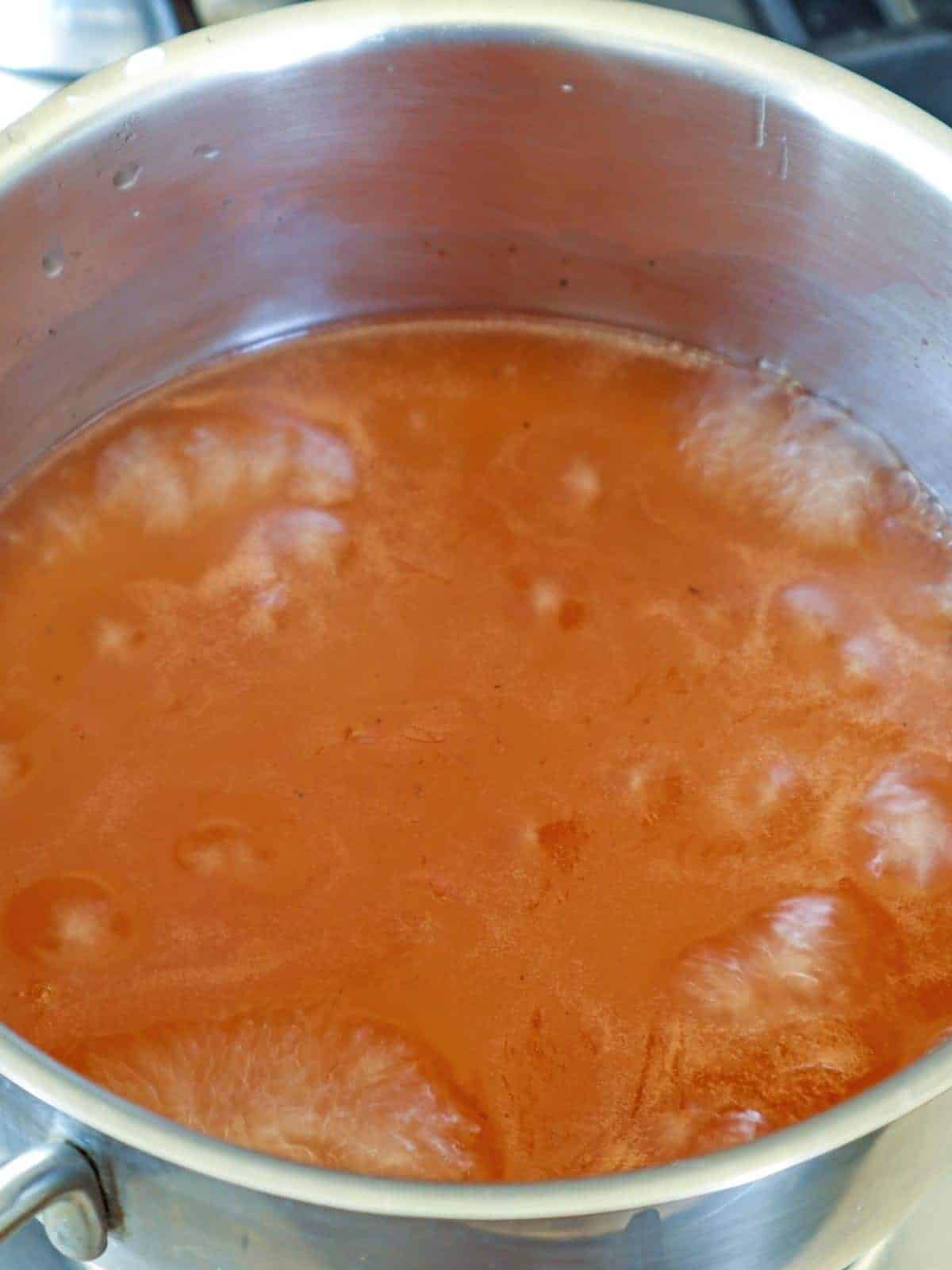 cooking escabeche sauce in a pot