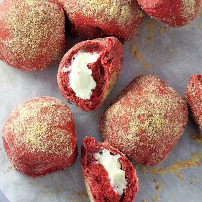 red velvet bread rolls on a parchment paper