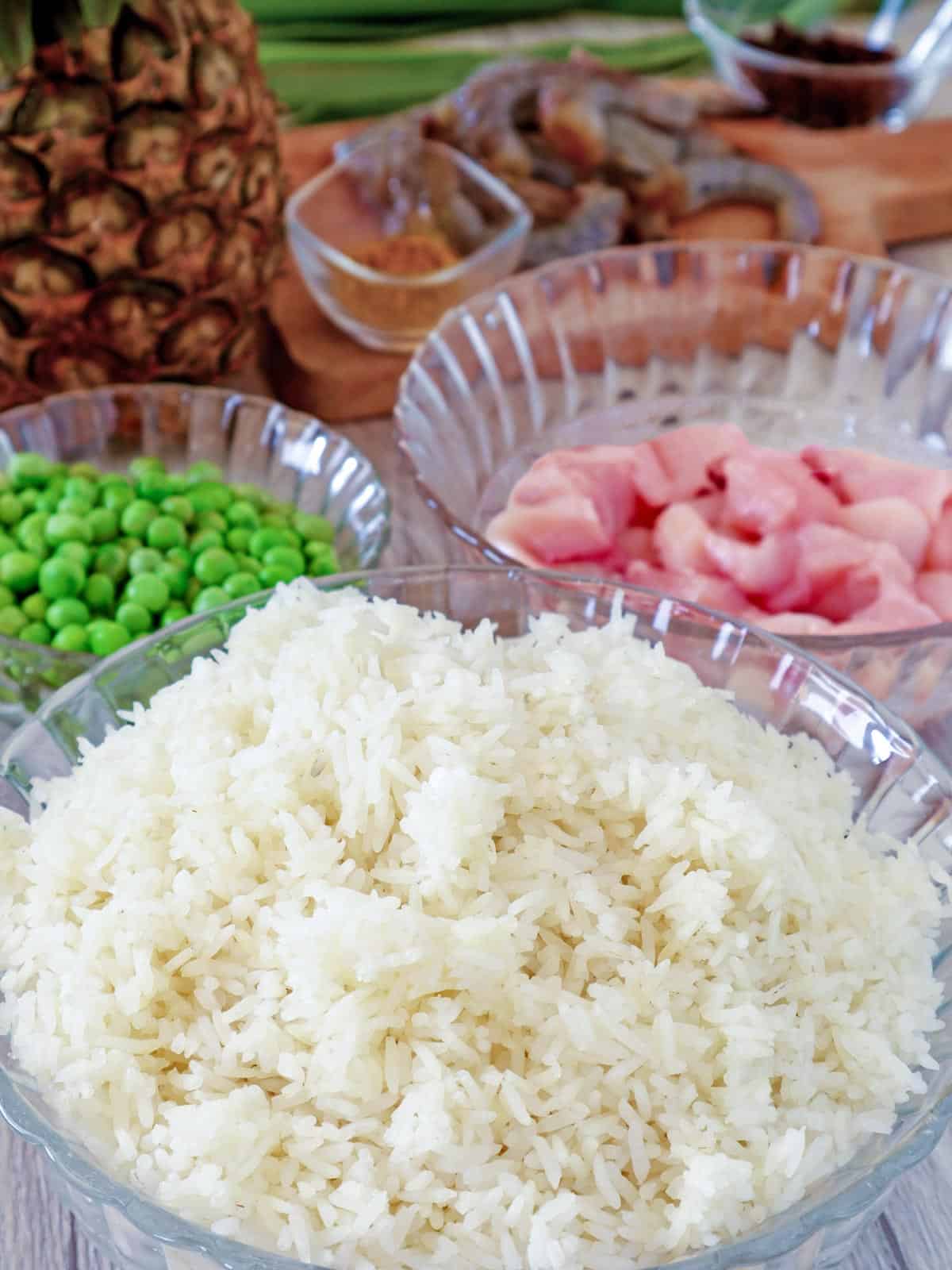 steamed rice, chicken, shrimp, green peas, pineapple