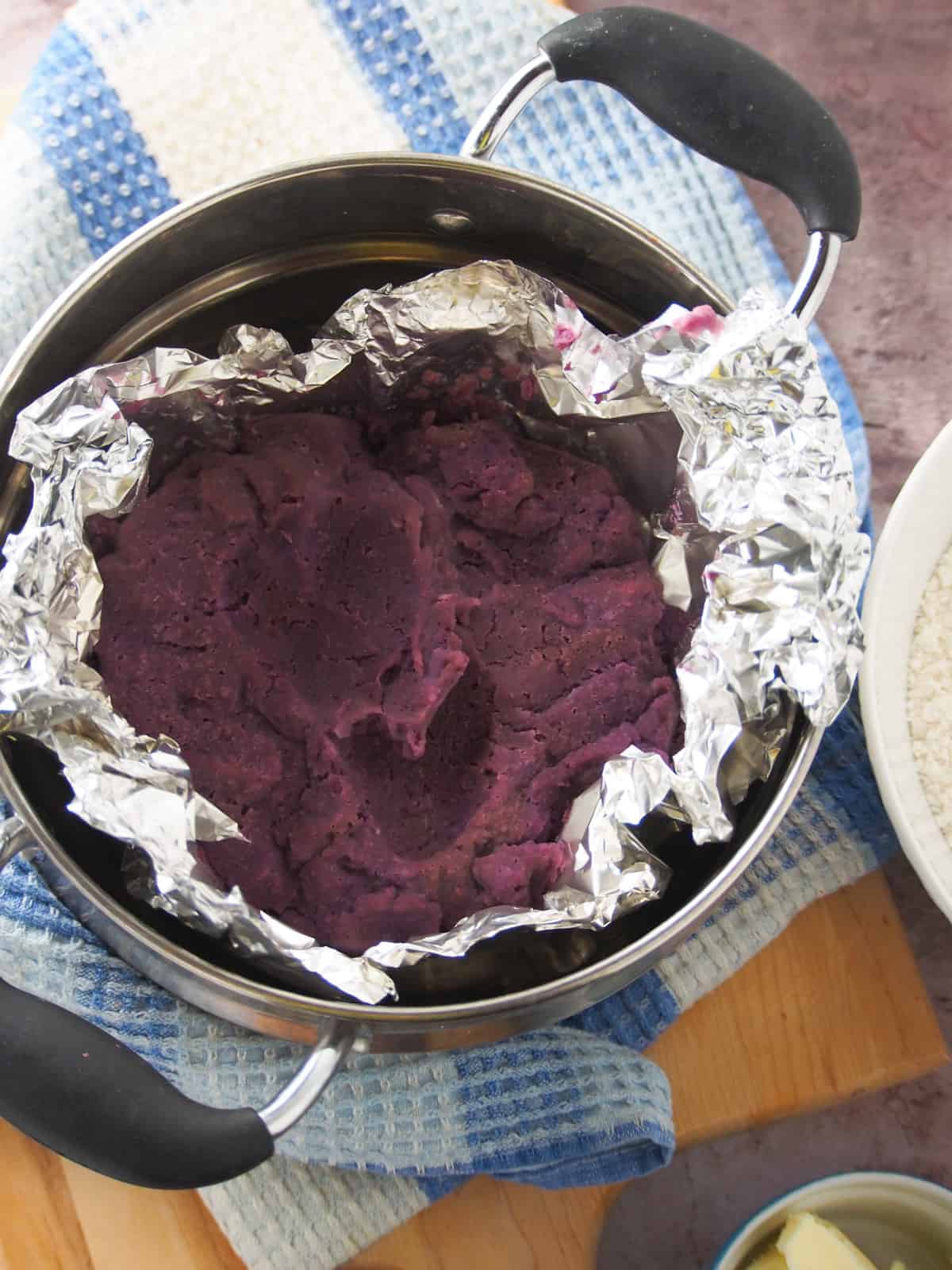 mashed purple yam in a steamer.