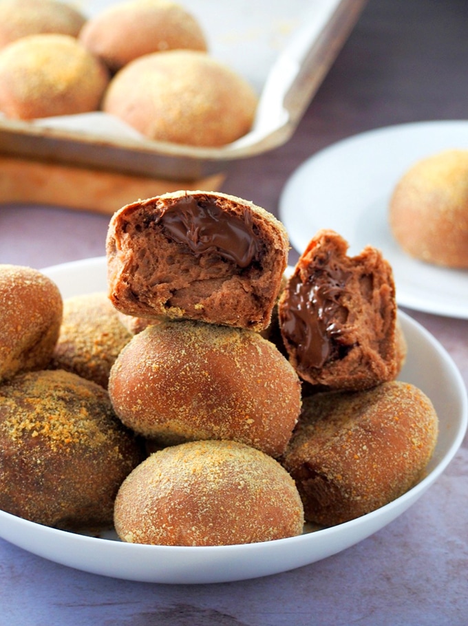 chocolate pandesal on a white plate