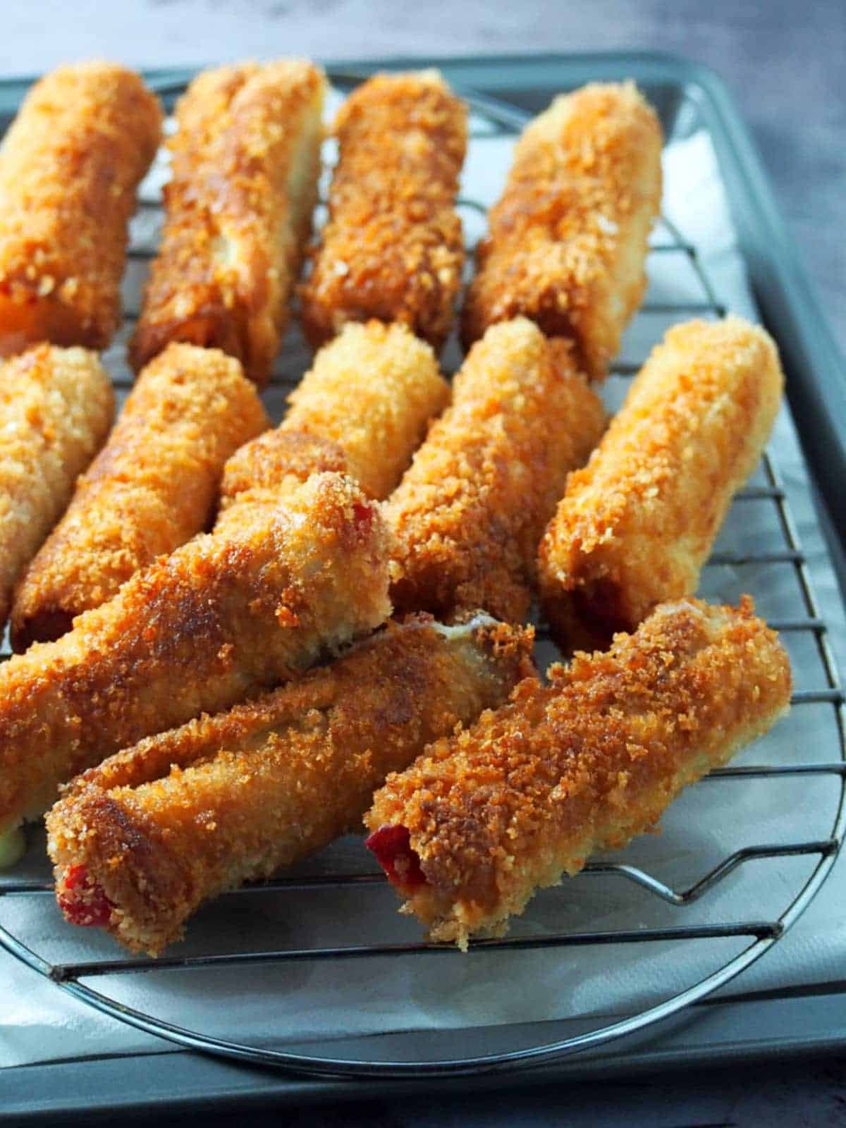 cheese dog bread rolls on a wire rack