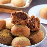 chocolate pandesal on a white plate